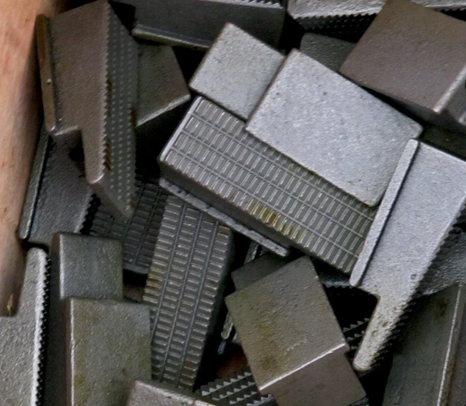 Grit face dies and inserts for oilfield equipment